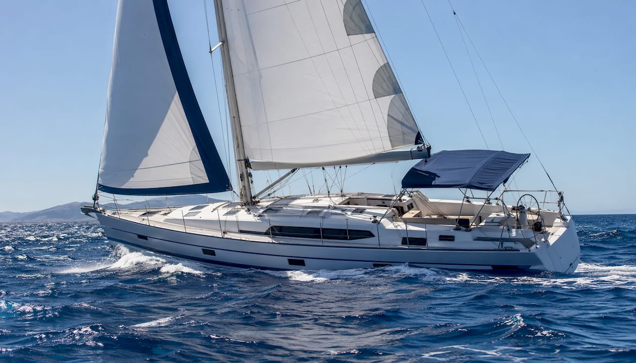 Sailing yacht under strong Meltemi wind on Aegean Sea Sailing yacht under strong Meltemi wind on Aegean Sea