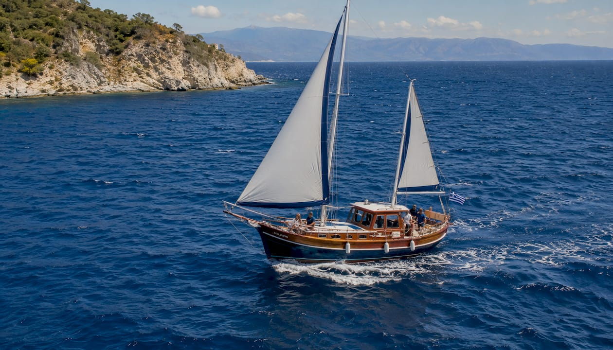 Monohull sailing yacht on blue ocean waters