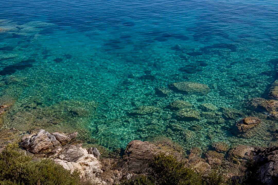 Rocky shoreline and clear water for snorkeling