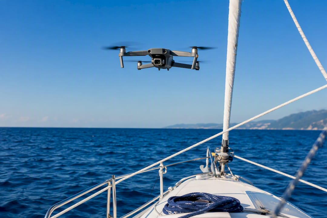 Drone flying above a sailing boat in Halkidiki