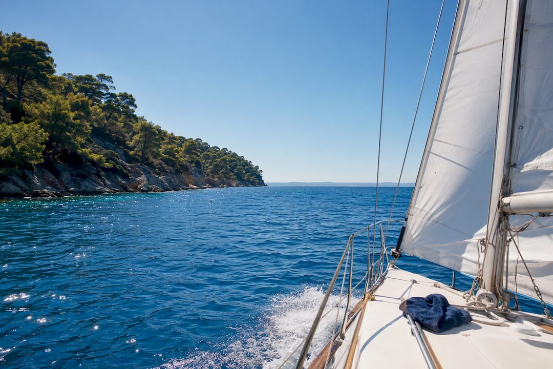 Sailing boat beside Sithonia coastline